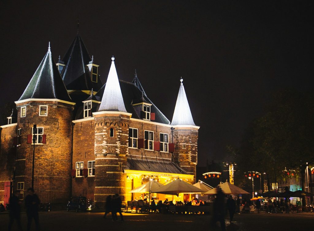 a large building with a lot of lights on top of it Leeuwarden